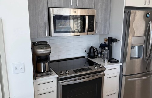 MIT Apartment | Upscale home with breathtaking view, full kitchen, living room and balcony