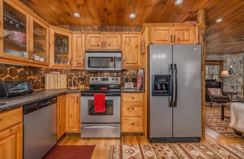 Elk Park Cabin | Upscale mountain log cabin with decks, fireplaces, & two primary bedrooms