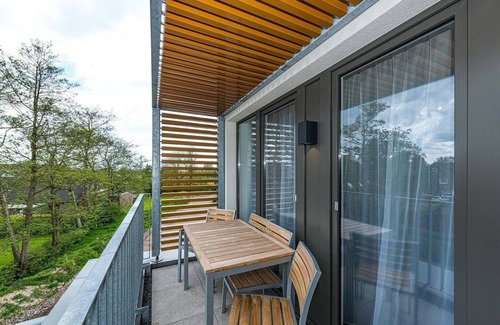 Bensersiel Apartment | Vacation apartment near the North Sea with balcony, parking, use of swimming pool & sauna -