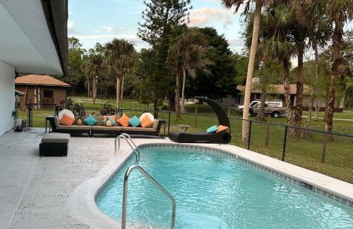 Naples House | Vacation pool home in the woods.