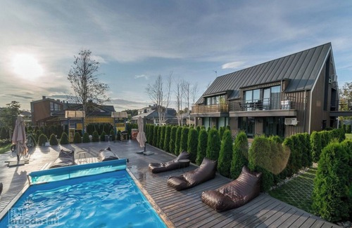 Palanga Apartment | Vaivorykstes Namai with Heated Pool by Hostlovers