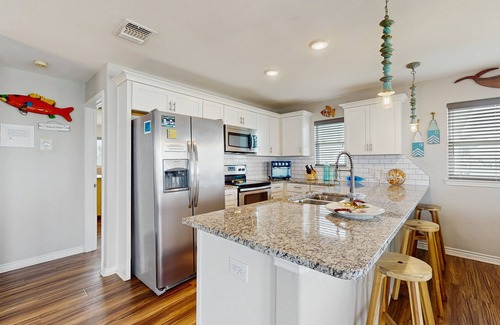 Rockport House | Vibrant bay front home with fenced yard & large decks - steps to sand & fishing