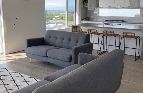 Portarlington House | Views On The Hill - Luxurious escape with a heated swimming pool, and stunning views.