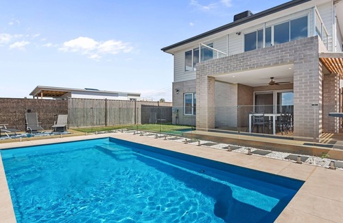Portarlington House | Views On The Hill - Luxurious escape with a heated swimming pool, and stunning views.