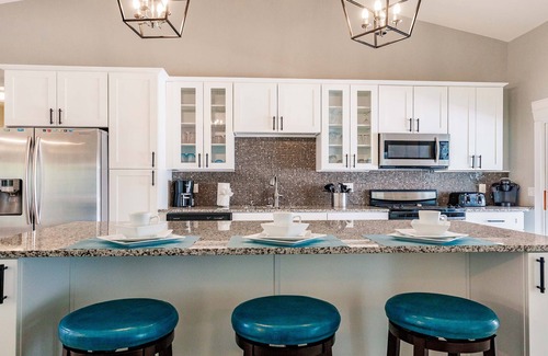 Cape Coral Villa | Villa Coral Cove heated pool, large lanai, lounge and fire pit in For Mile Cove