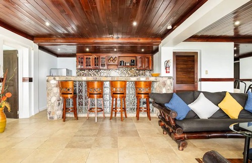 Tower Isle Apartment | Wake up to panoramic ocean views & relax by your own private jetty steps away.n