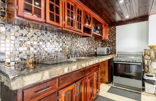 Tower Isle Apartment | Wake up to panoramic ocean views & relax by your own private jetty steps away.n