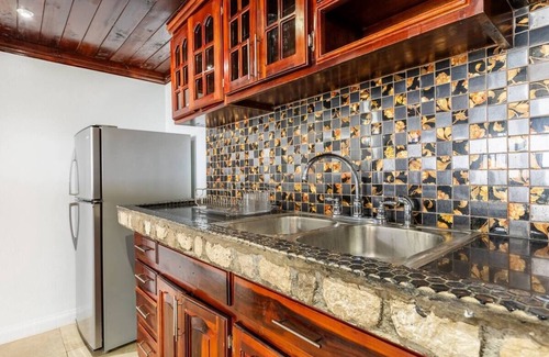 Tower Isle Apartment | Wake up to panoramic ocean views & relax by your own private jetty steps away.n