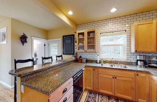 Olga House | Walkable Bay-view home with large yard, firepit & washer/dryer - pier access