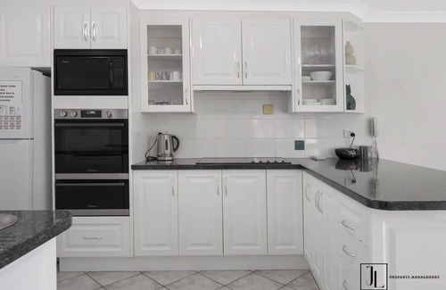 Denhams Beach House | Water Views, Wi-Fi & Beach | Grand Entertainer