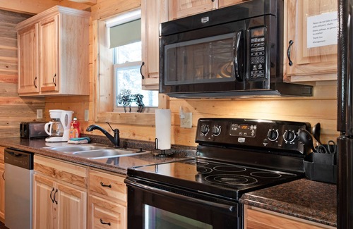 South Fork Cabin | Waterfront cabin with bridge, private hot tub, & WiFi - near National Forest