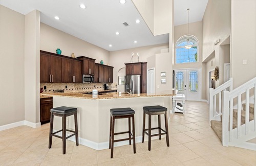 Burnt Store House | Waterfront dog-friendly house with pool, dock, pool spa, patio & sunrise views