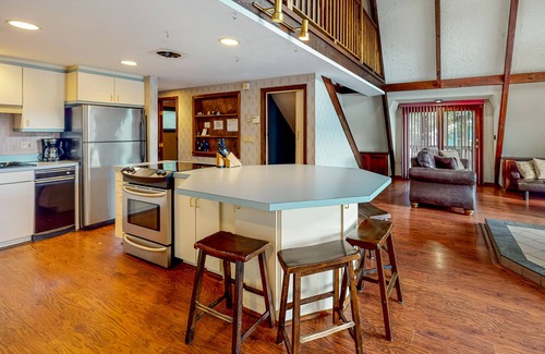 Barnstead House | Waterfront home with wraparound deck, floating fireplace, deck, & firepit