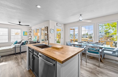Colington Harbour House | Waterfront home and Oasis with private dock, outdoor bar and firepit