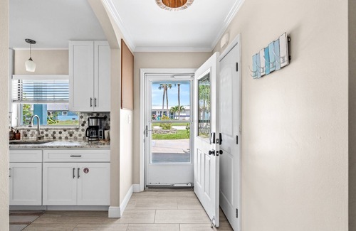 Convair Cove House | Waterfront Home with Dock | Heated Pool | 4.5 Blocks to Beach & Downtown