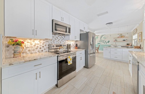 Convair Cove House | Waterfront Home with Dock | Heated Pool | 4.5 Blocks to Beach & Downtown
