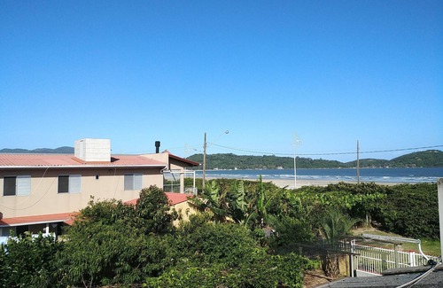 Palhoca House | Waterfront home with large green yard