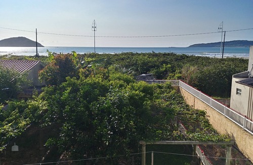 Palhoca House | Waterfront home with large green yard