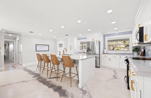 Palm Harbor House | Waterfront Island Oasis FULLY REMODELED! W/BOAT DOCK!