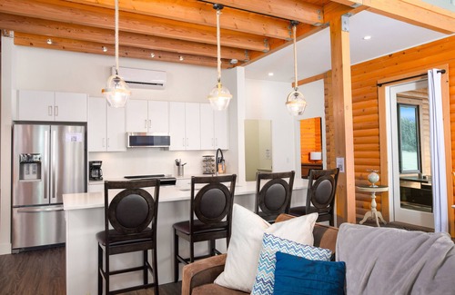 Central Okanagan Ski Chalet | Waterfront Kelowna Cabin #1 sleeps 15 has a private hot tub & is pet friendly