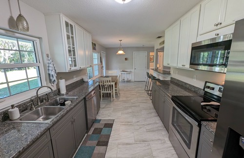 Crystal River House | Waterfront Paradise w dock, large patio, lanai, pool, hot tub! Bring your boat!