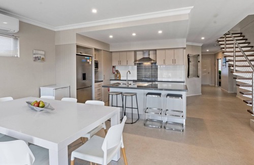 Exmouth House | Wave - Modern Villa on the Exmouth Marina with boat mooring.