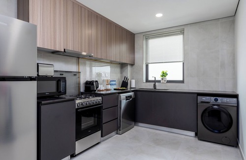 Dubai Apartment | Waves - Stylish 1BR Close to IMG World & Global Village