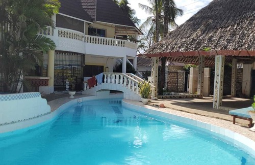 Galu Kinondo Cottage | We are located in Galu Beach opposite lantana Hotel.