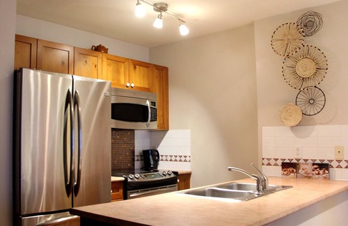 Village North Condo | Welcome to our 1BR Top floor Unit at Town Plaza