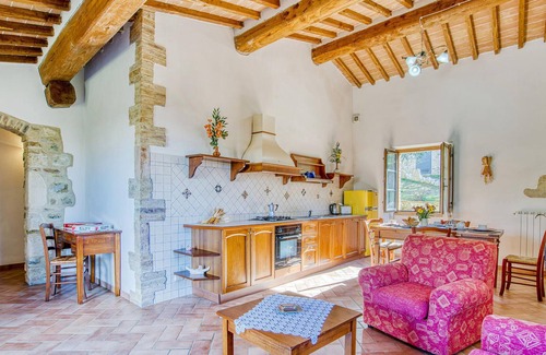 Radicondoli Apartment | Welcome to this charming stone house with shared pool and panoramic views of beautiful surroundings.