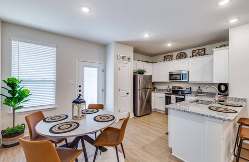 San Antonio House | Welcome to your perfect San Antonio home! This spacious 3-bedroom, 2.5-bath house features a large, fully equipped kitchen and plenty of room for family and friends. Enjoy modern comforts, a private backyard, and easy access to downtown attractions.