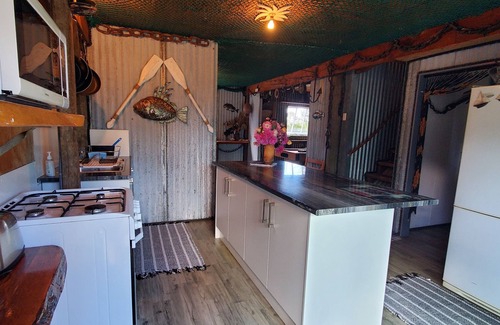 Coromandel House | Western Theme Mural,Private,Unique,Rustic,Sea Views,Sunsets,Bush,Pet friendly.