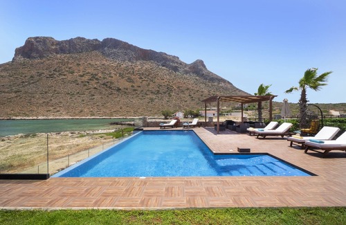 Stavros Villa | When the pool touches the sea.In front of the beach Antony Quinn danced syrtaki!