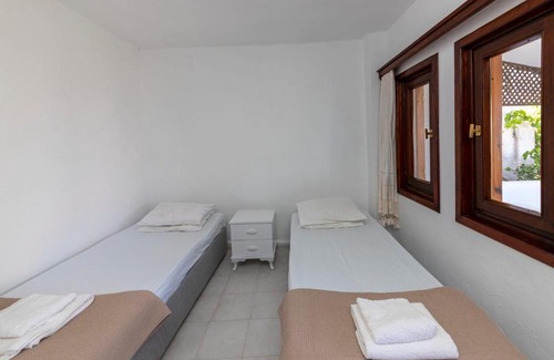 Dagbelen House | White House with Mediterranean Sea View near Camel Beach in Bodrum