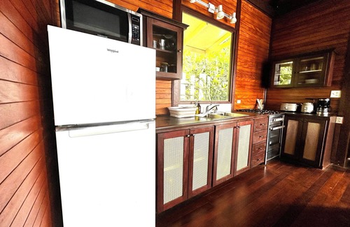 Brewers Bay Cottage | Whole Bayview Cottage with large deck and sea view, mid-way to beaches and town.
