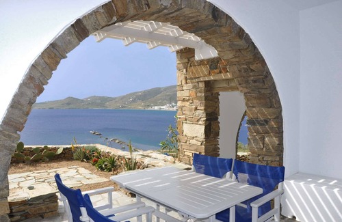 Tinos House | Windmill and houses by the sea // Stavros Bay