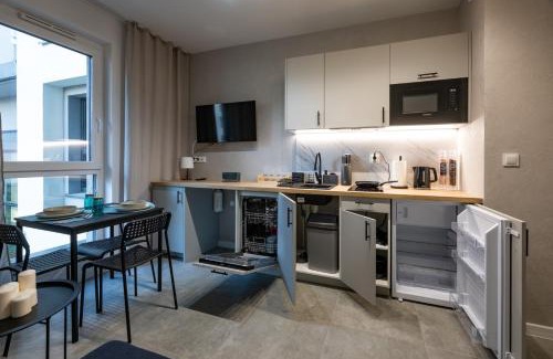 Srodmiescie Apartment | Work and Rest Apartment by Fengshui4u, cowroking, siłownia, nowy budynek, dostęp na kod