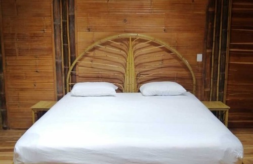 Ballena Cabin | Yogachal Vista Mar bamboo cabiña in jungle w waterfall and seaview yoga deck