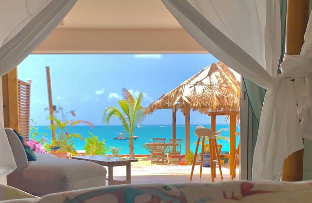1 or 2 bedrooms Beach Front Property with Private Garden overlooking the beach
