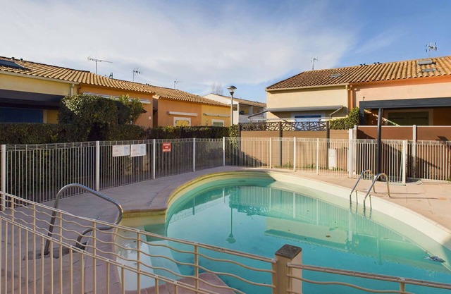 2-Room Ground Floor Apartment with Terrace and Parking in Secure Residence with Pool