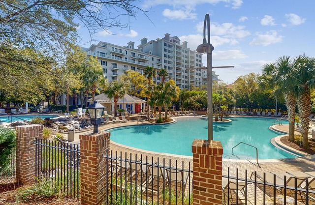 2nd-floor resort condo with balcony, on-site pool, golf, tennis & beach access