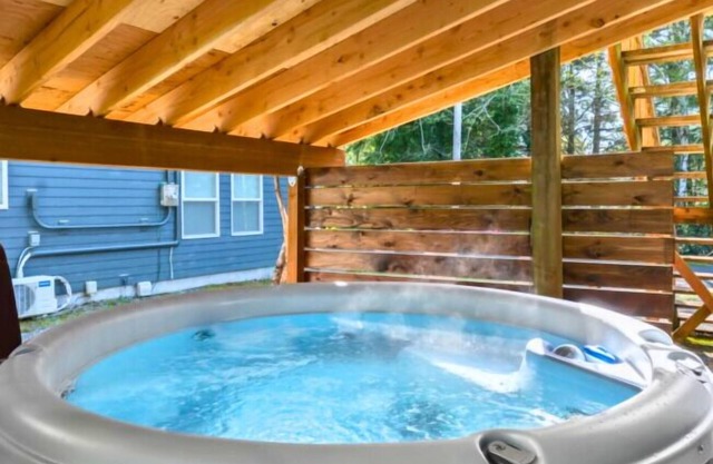 4BR beach retreat with hot tub, fire pit, BBQ, and pet-friendly vibes—walk to sand & shops!