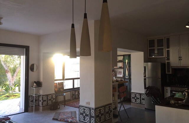A bright ground floor with garden in a high standing residence