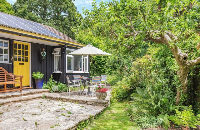 A charming bungalow with an LSWR train attached.