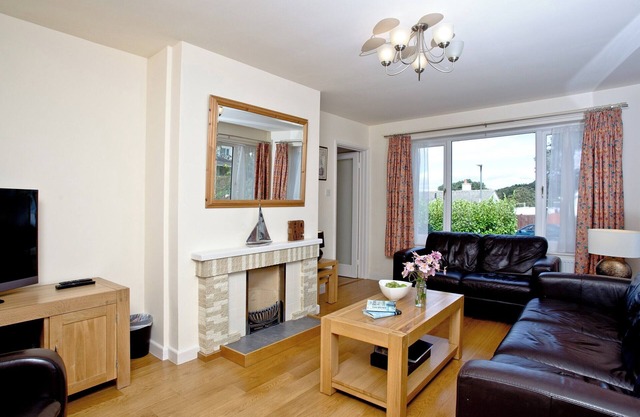 A family friendly retreat with large garden, close to a secluded cove.