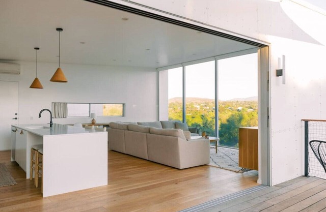 A modern light-filled home with views of the woods