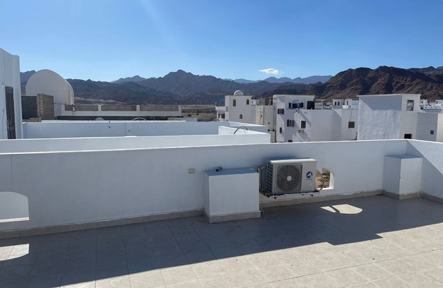 A private chamber with a rooftop, and a patio.