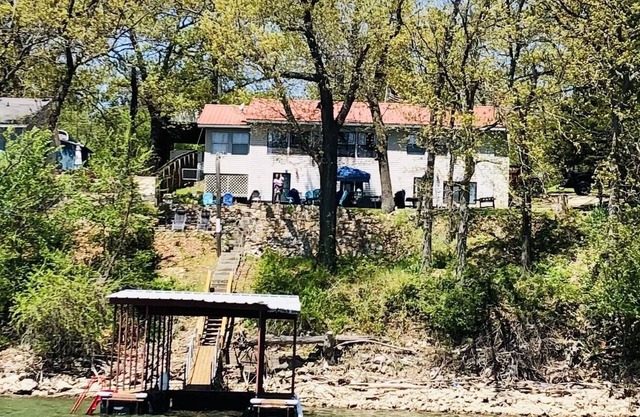 A serene waterfront view with private dock. Spend quality family time and relax.