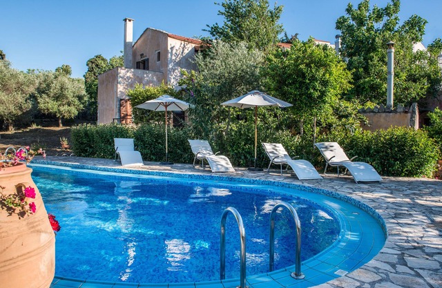 Antheia guest houses . Three houses in a big garden with swimming pool.