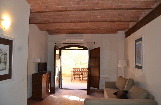 Apartment with balcony in medieval village with swimming pool, tennis, in the countryside near the sea and services